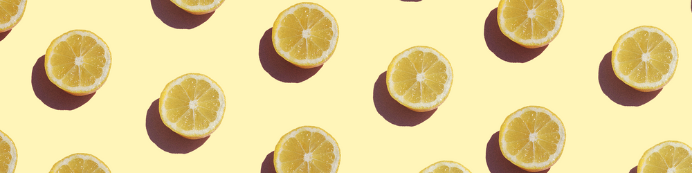 A pattern of lemons on a yellow background